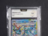 a close up of a pokemon card in a plastic case