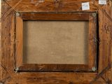 an old wooden picture frame with a label on it