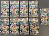 Les paquets de cartes à collectionner Pokémon sont alignés sur une table
