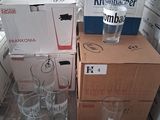 many boxes of beer and glasses on the table