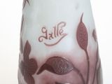 a glass vase with a design on it on a white surface