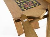 a small wooden table with a pattern on it