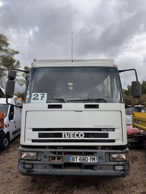 a white truck that is parked in a lot
