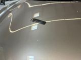 a remote control on the hood of a car