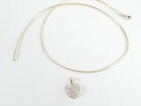 a gold necklace with a heart pendant on a white background