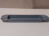 a gray plastic container on a white table