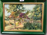 une peinture à l'huile représentant une maison, dans un cadre vert, accrochée au mur