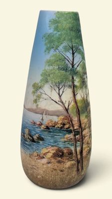 a vase with a picture of a beach scene on it