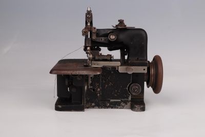 an old sewing machine that is sitting on a table