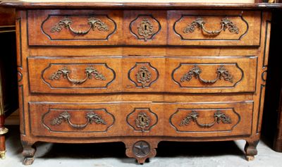 a wooden chest of drawers with a mirror on top of it