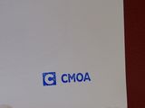 a white piece of paper with a blue cmoa logo on it
