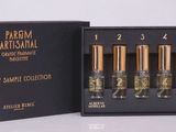 une boîte noire contenant six flacons de parfum