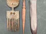 a knife, comb, and other items that are on a table