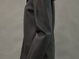 mannequin dressed in a black coat with a black fur collar