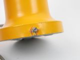 a yellow fire hydrant that has a small bug on it