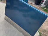 a blue box sitting on the back of a truck