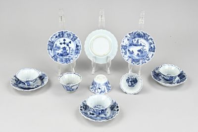 a group of blue and white dishes and cups and saucers