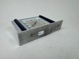 a metal clock that is sitting on a table