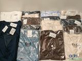 a lot of men ' s shirts on display in the store