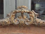 a close up view of a gold sculpture on top of a building