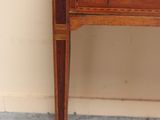 a small wooden table with a drawer on top of it