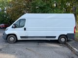 a white van that is parked in a parking lot