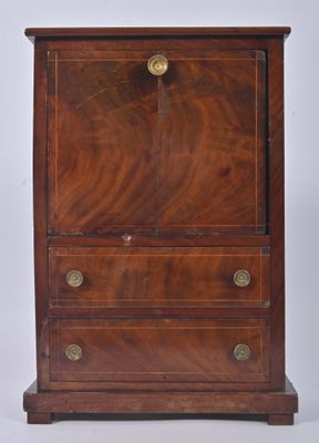 an antique wooden chest of drawers with brass hardware on top