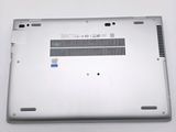 the back cover of a laptop with a small hole in it