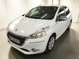 the small white car is parked in a large room