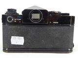 a black camera sitting on top of a white table