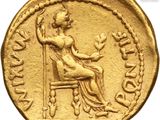 an image of a gold coin with a woman sitting on a chair