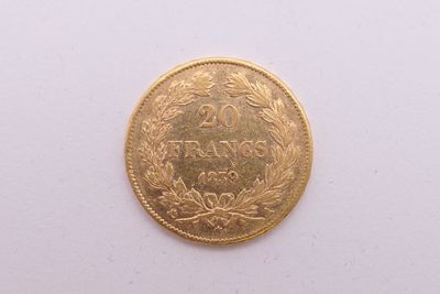 une image d'une pièce d'or sur une surface blanche