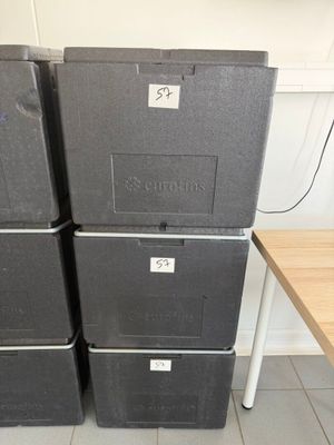 several boxes are stacked on top of each other in a room