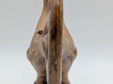 wooden sculpture of an elephant ' s head on a white background