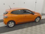 an orange car is parked in a garage with a checkered floor