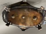 a metal object hanging from the ceiling of a room