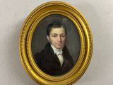portrait of a man in a black coat and white shirt