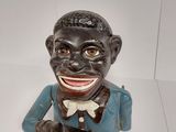 a small statue of a black man with a bow tie