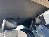 the back seats of a car with the sun shining through the window