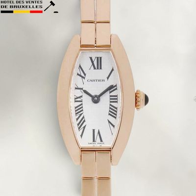 an image of a close up of a wrist watch with roman numerals