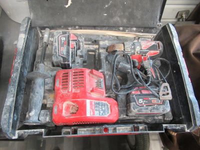a box with tools in it sitting on a table