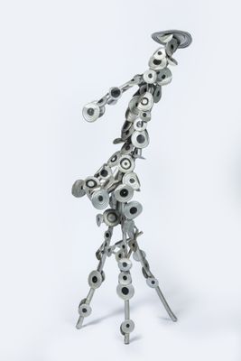 a metal sculpture of a giraffe made out of metal parts