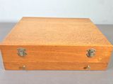 a small wooden box that is on a table