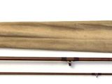 three different types of fishing rods on a white surface