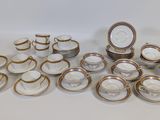 many plates and cups that are sitting on the table