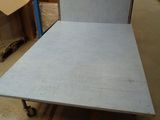 a bed that is sitting in the middle of a room