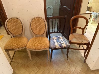 three chairs that are sitting next to each other in a room