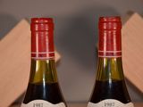two bottles of wine that are sitting on a table