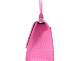 pink crocodile skin handbag on white background with clipping for text
