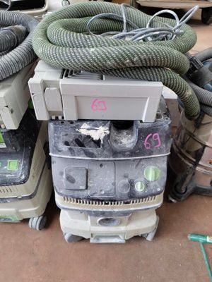 several vacuums are stacked on top of each other on the floor